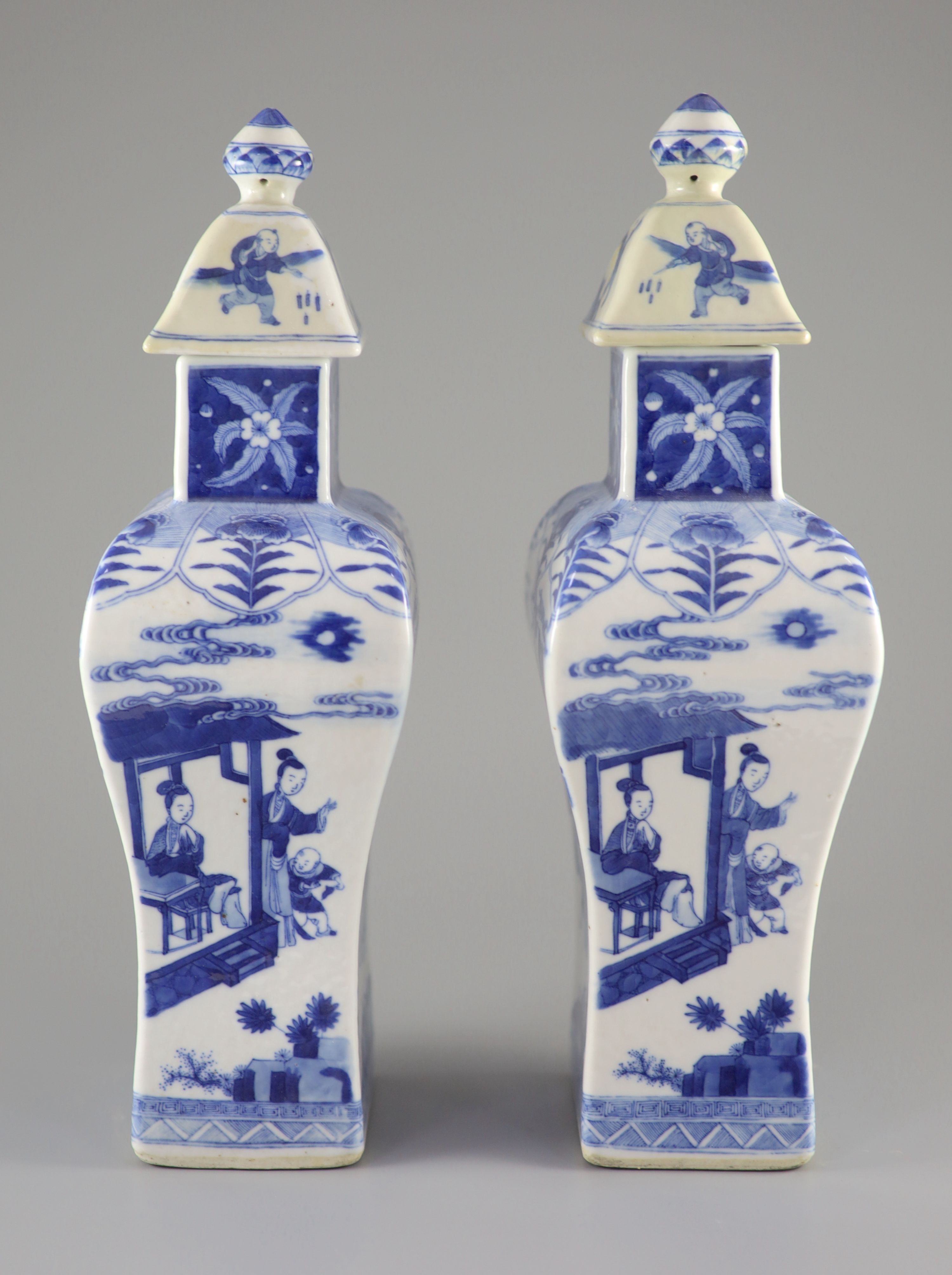 A pair of Chinese blue and white rectangular baluster vases and covers, Kangxi marks but 19th century, 36.5 cm